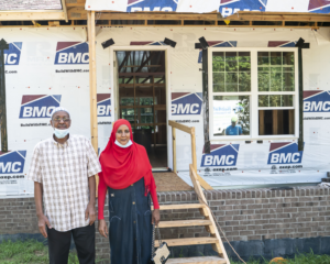 Elroyh and Afaf in front of their future home.