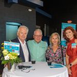 Four Habitat Greensboro sponsors and stakeholders smile at First Horizon's 2023 Blueprints and Bubbly table.