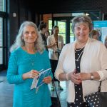 Habitat Greensboro Board Member, Trudy, smiles next to a Habitat Greensboro stakeholder at the 2023 Blueprints and Bubbly event.