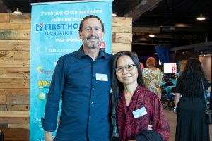 Habitat Greensboro stakeholders Jeff and Lien smile next to each other at the 2024 Blueprints and Bubbly event.