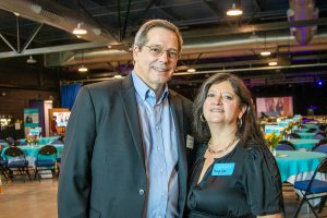 Habitat Greensboro's CEO, David Kolosieke, smiles next to his wife, Mary Ann, at Habitat Greensboro's Blueprints and Bubbly event